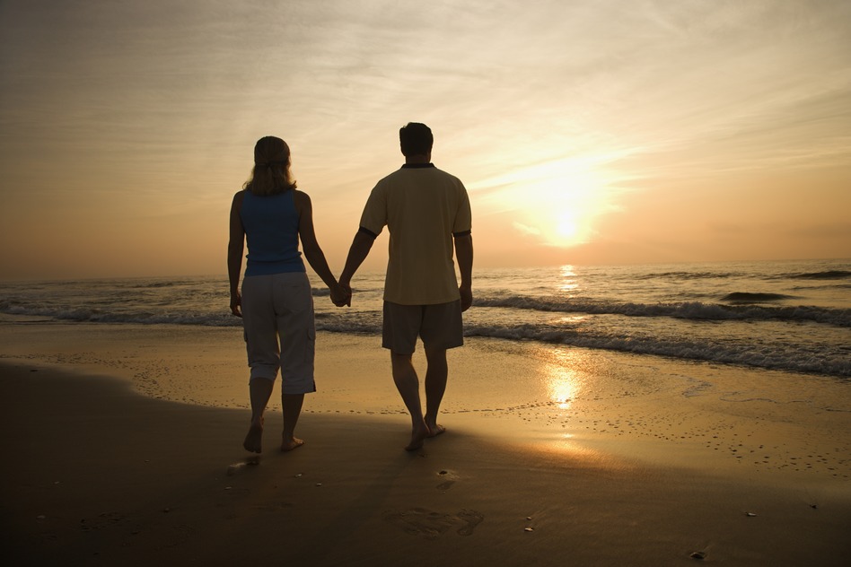 Couple on the beach at sunset