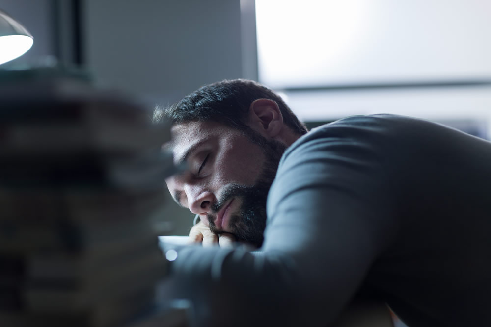 Man sleeping at desk